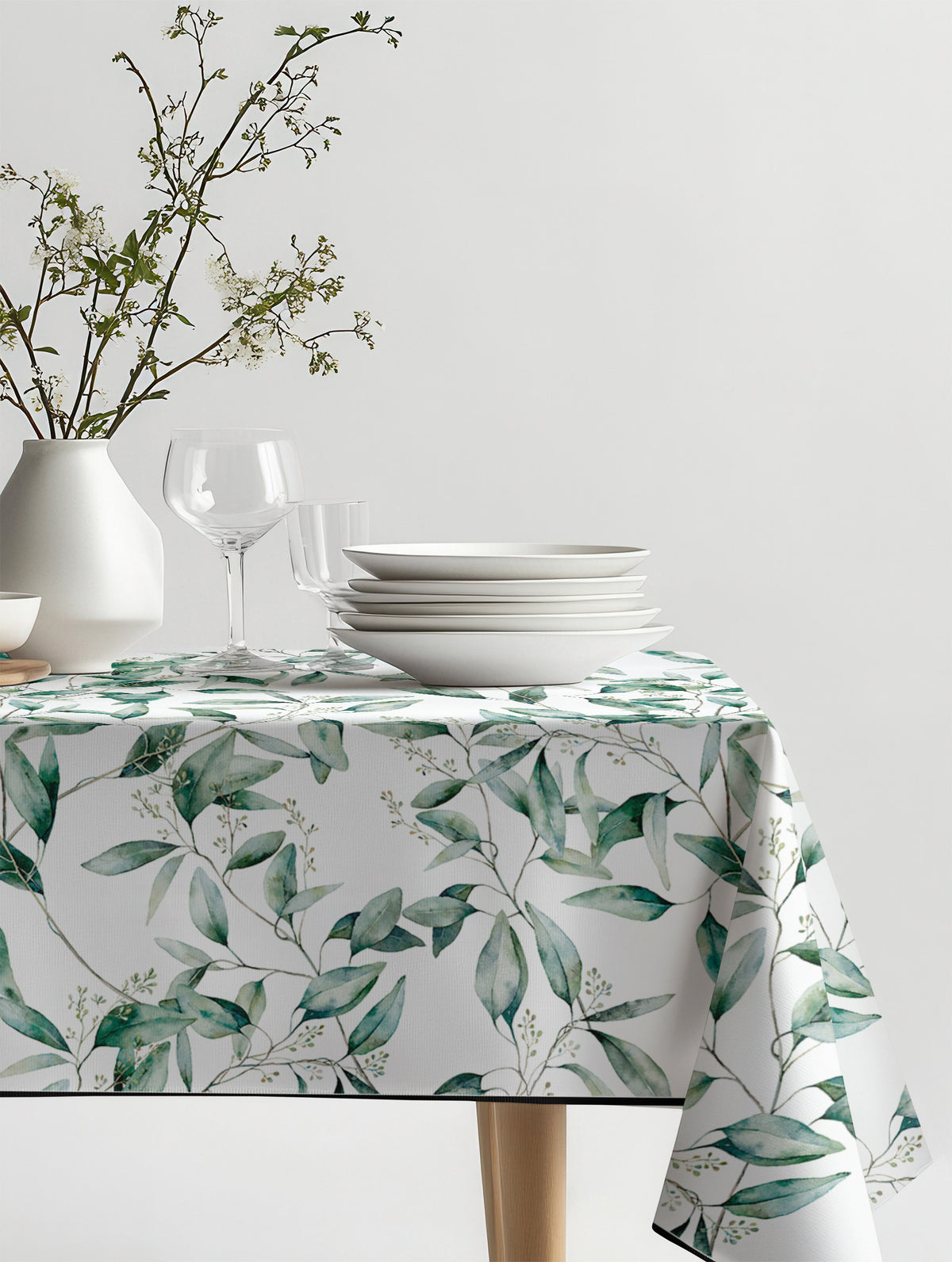 Mantel de hule Eugenia sobre una mesa