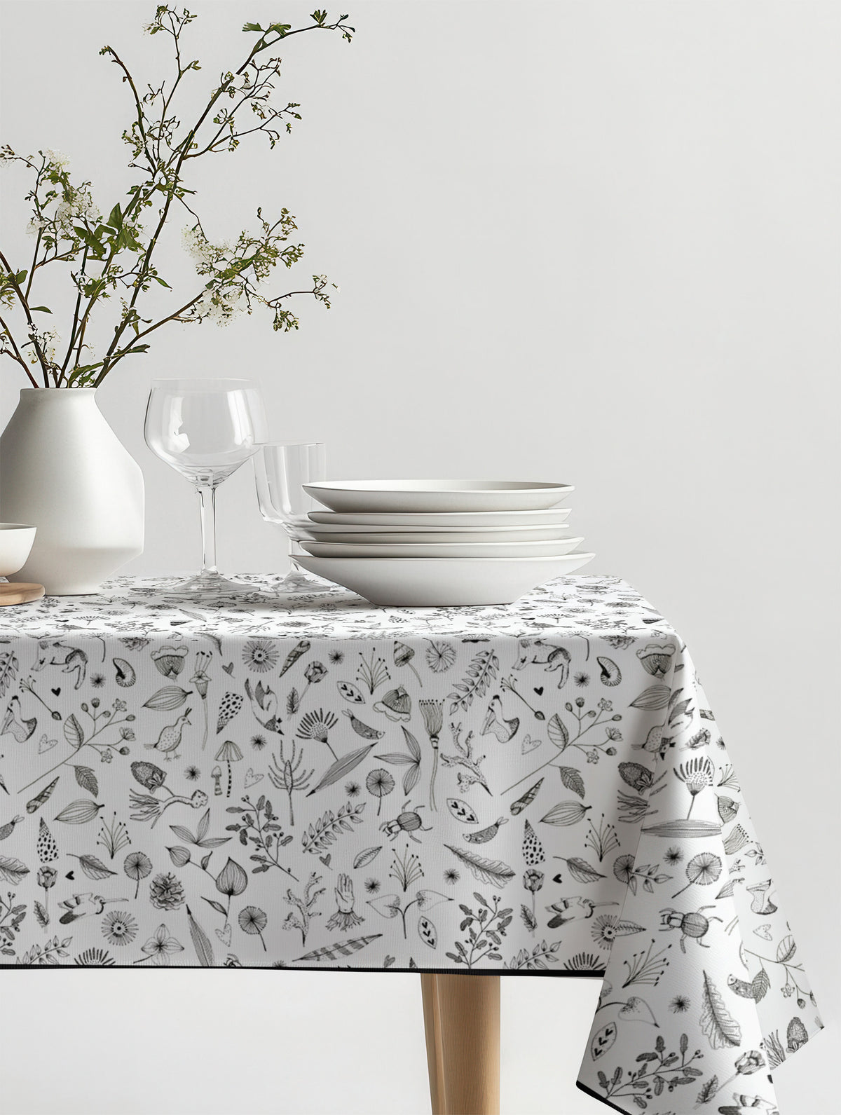 Mantel de hule Trini March sobre una mesa