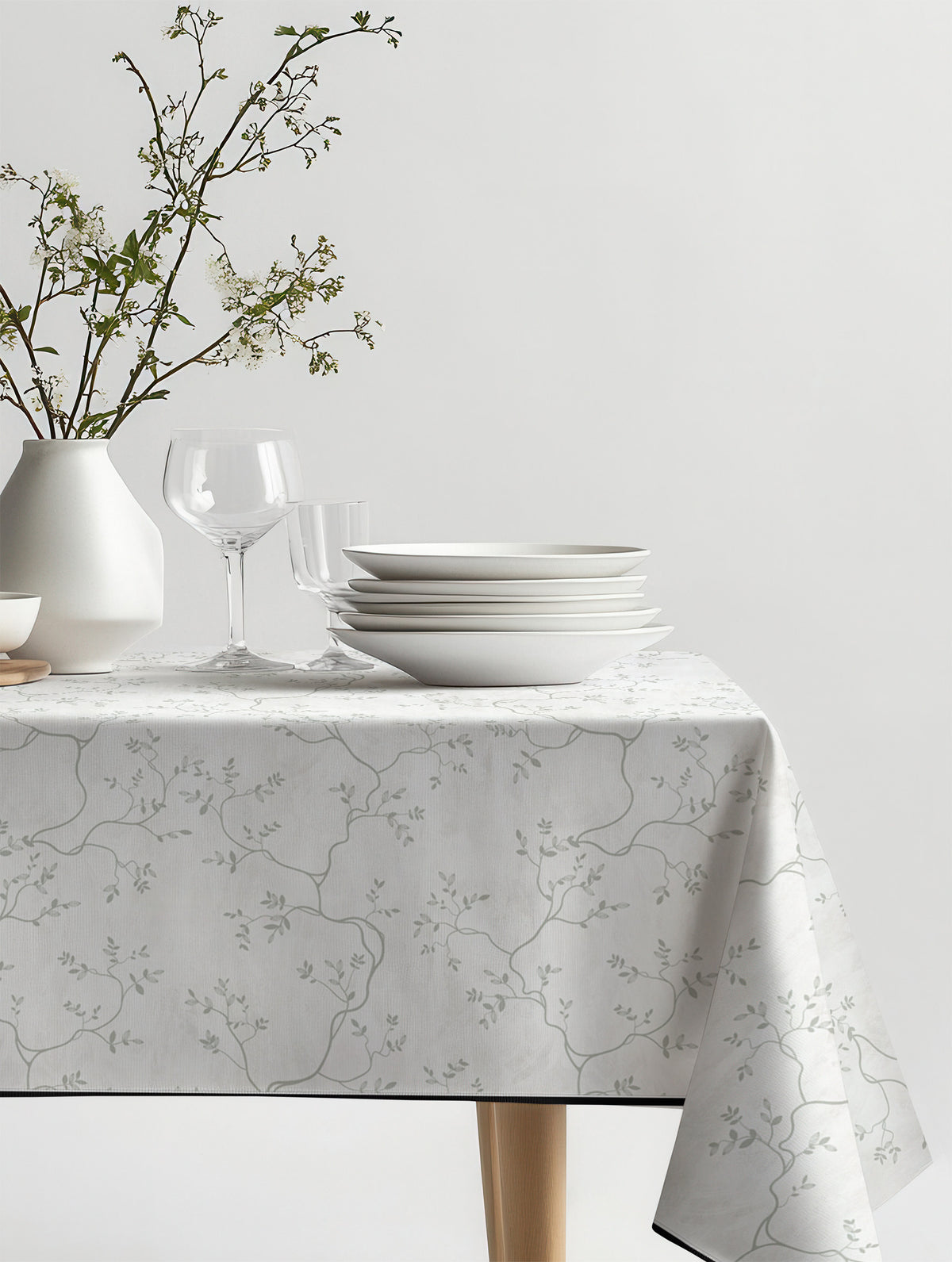 Mantel de hule Branche sobre una mesa