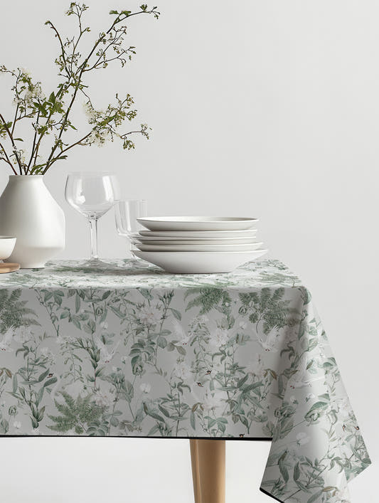 Mantel de hule Cisne sobre una mesa