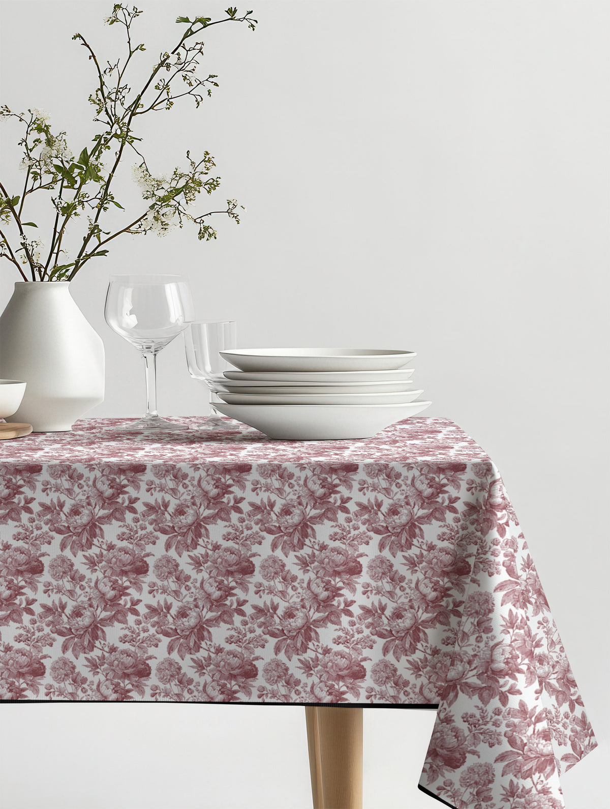 Mantel de hule Laura Red sobre una mesa