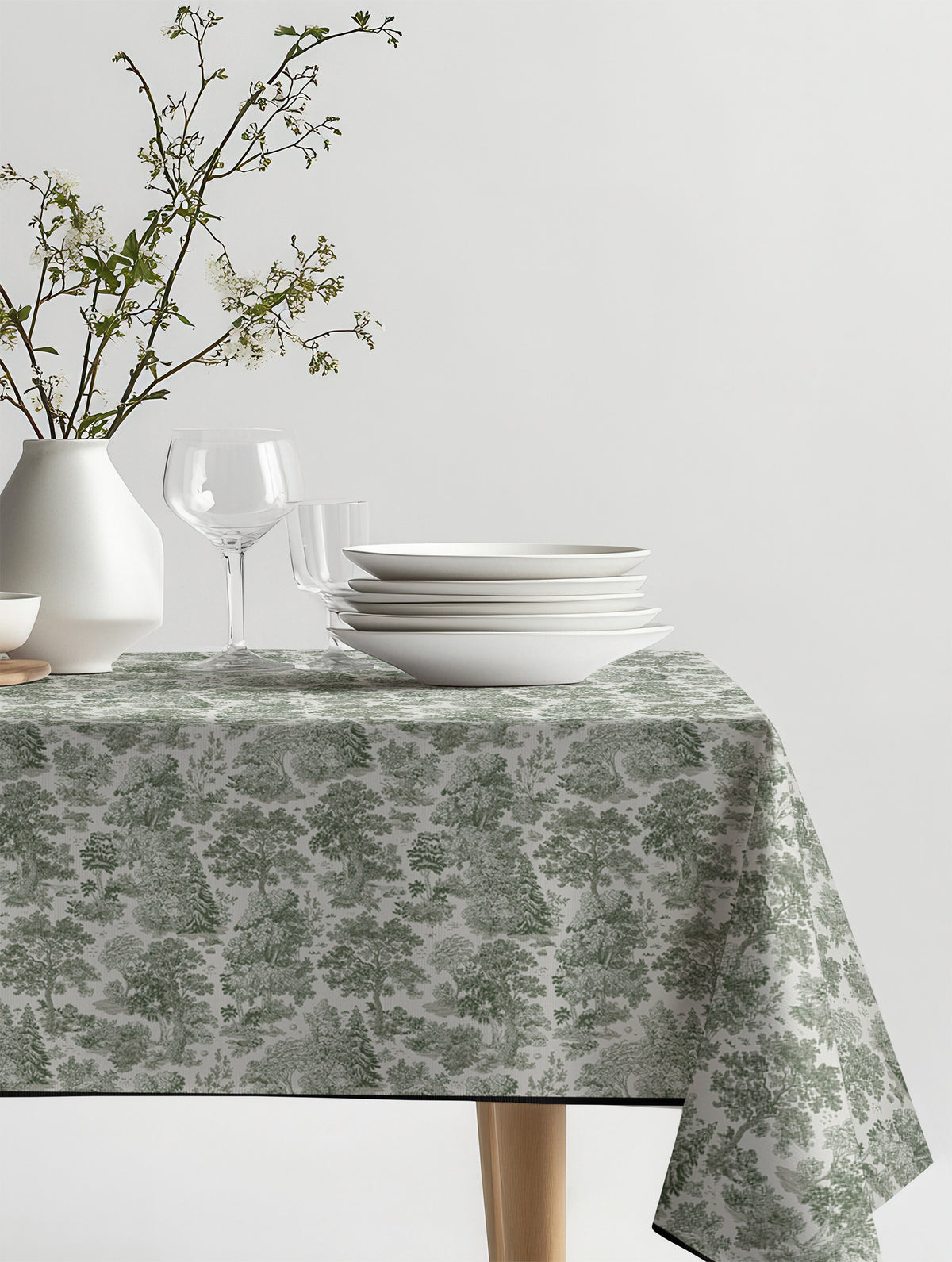 Mantel de hule Moulin Green sobre una mesa