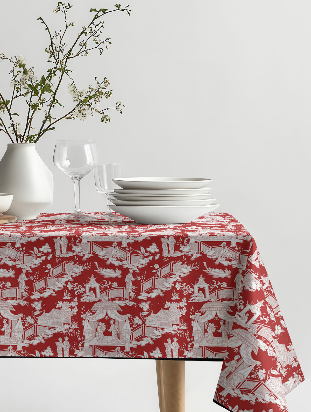 Mantel de hule Mulan Rojo sobre una mesa