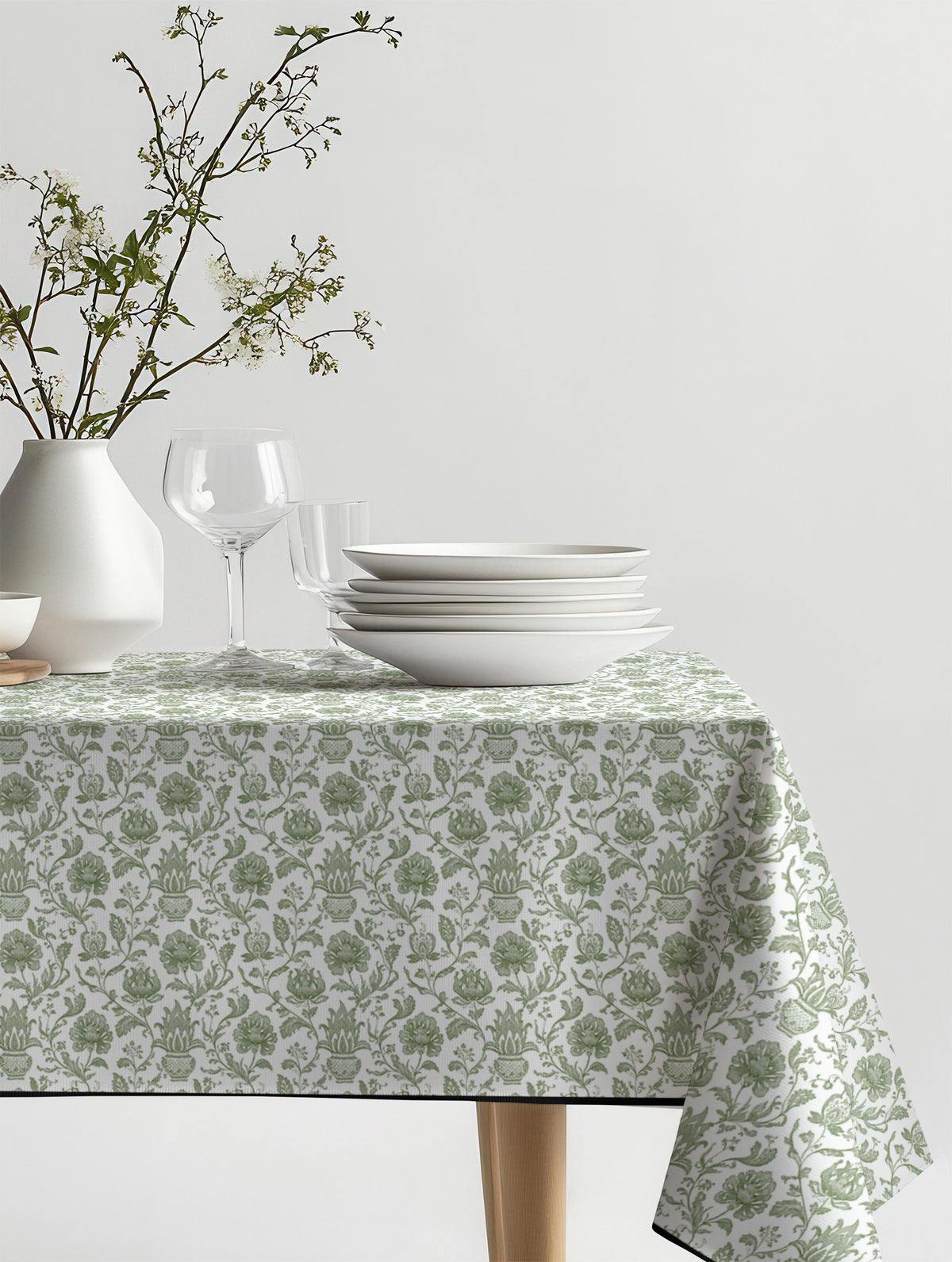 Mantel de hule Pottery Green sobre una mesa