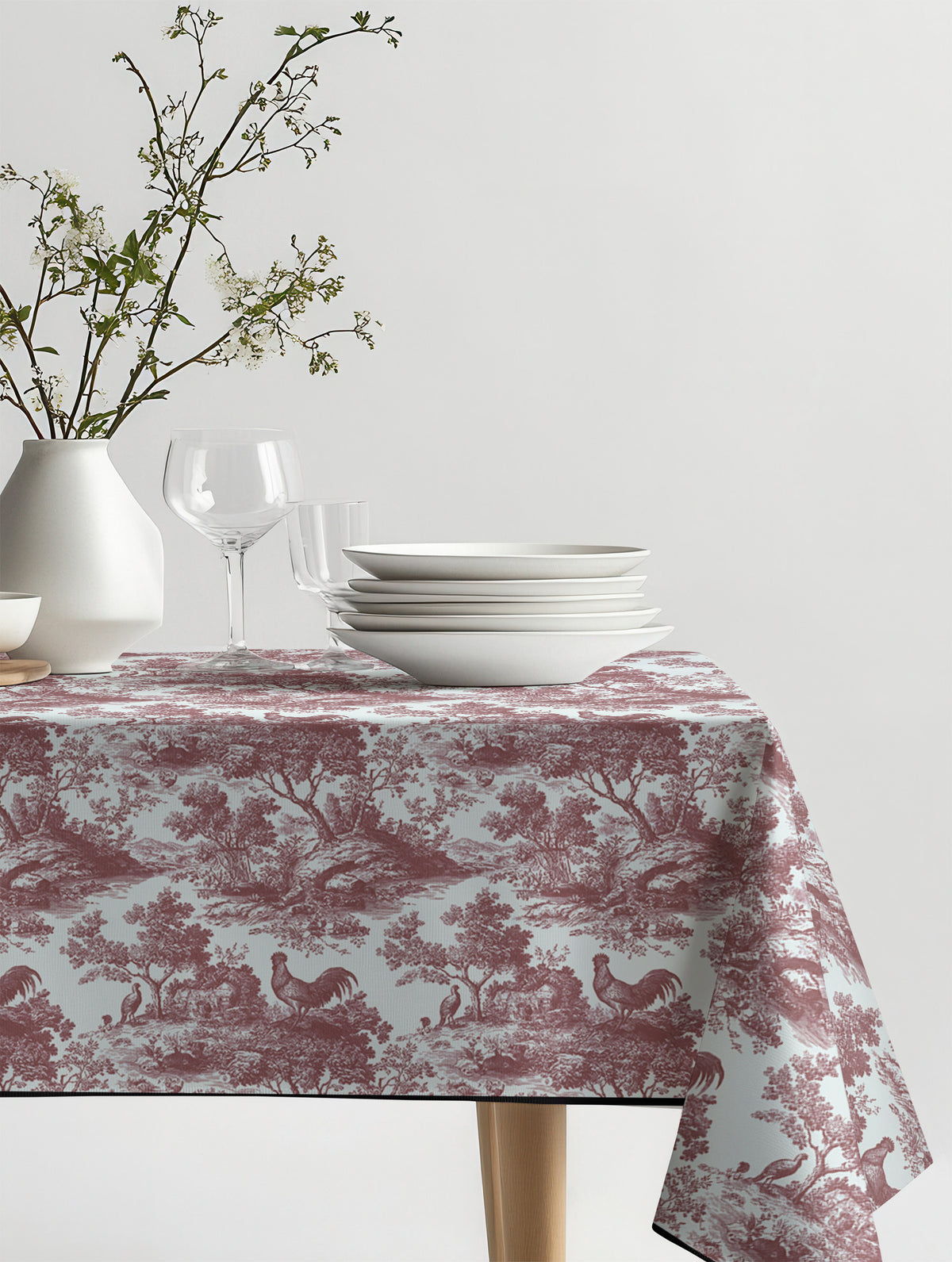 Mantel de hule Rooster Red sobre una mesa