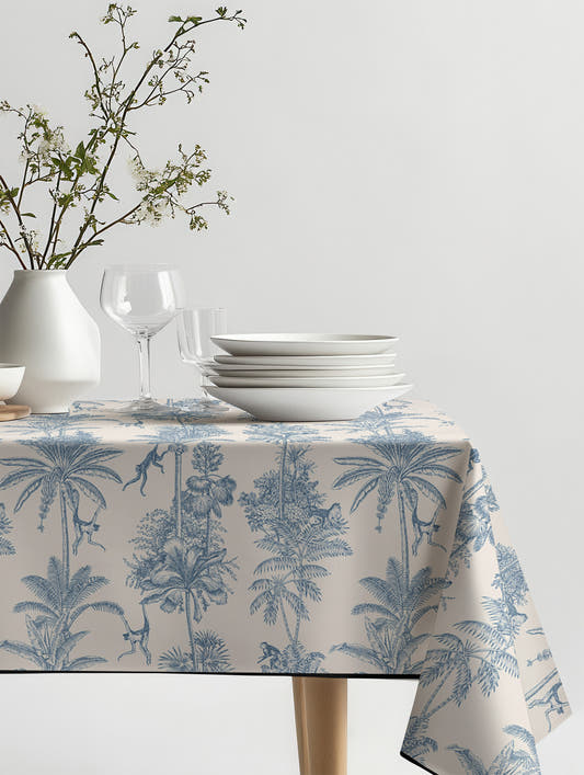 Mantel de hule Vintage Palms and Monkeys sobre una mesa