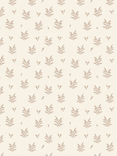 Papel mural Lucía, detalle del diseño: ramas de hojas terracota sobre crema.