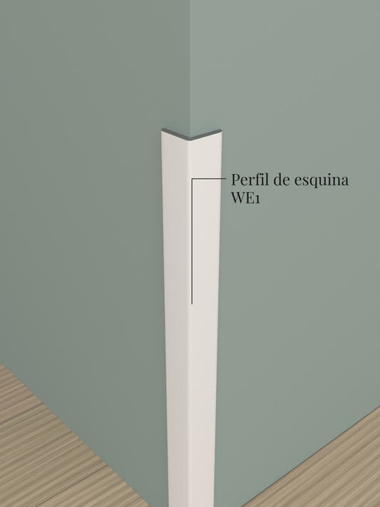 Perfil de esquina WE1 pegado sobre una esquina saliente del muro, con su extremo cortado a la vista